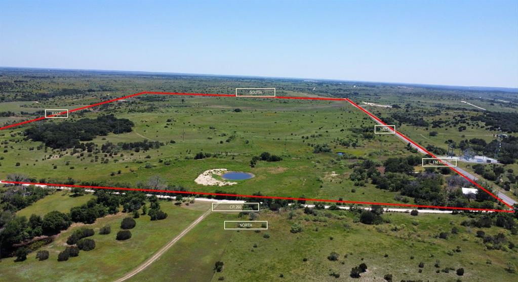 an aerial view of a golf course with a garden