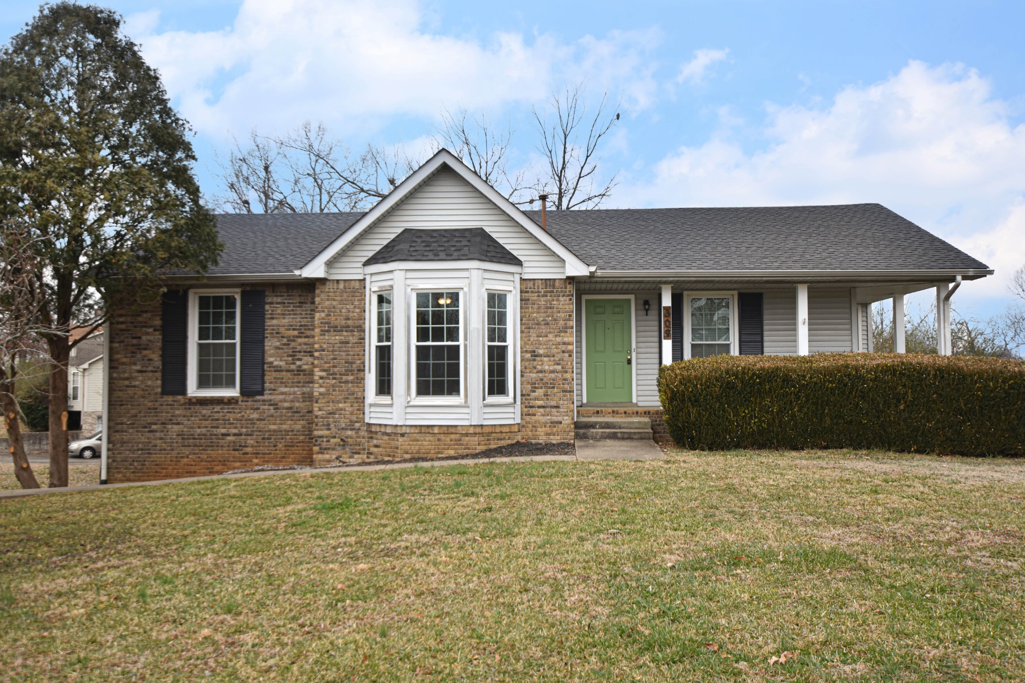 a front view of a house with garden