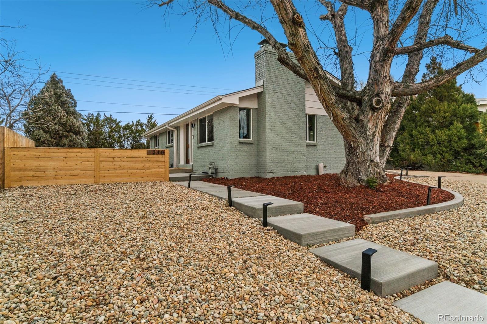 a view of a backyard with sitting area