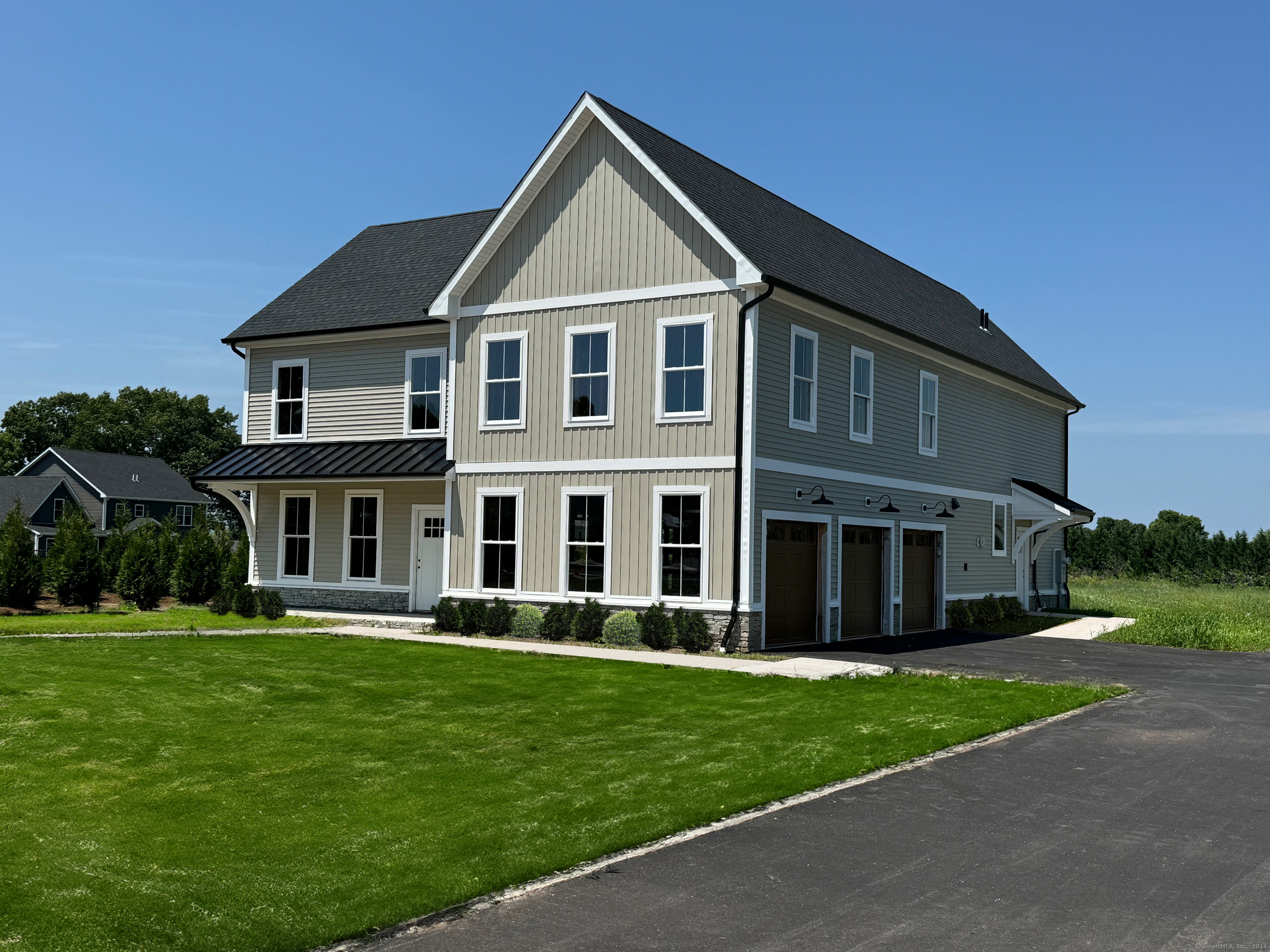 a front view of a house with a yard