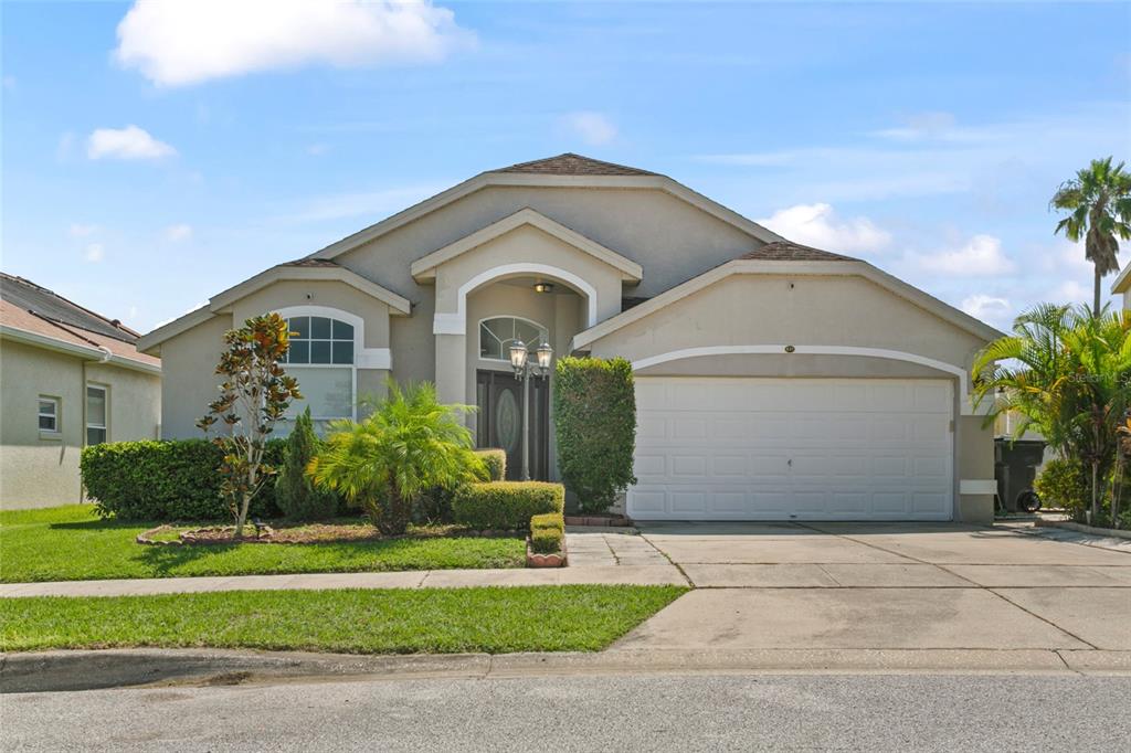 a front view of a house with a yard