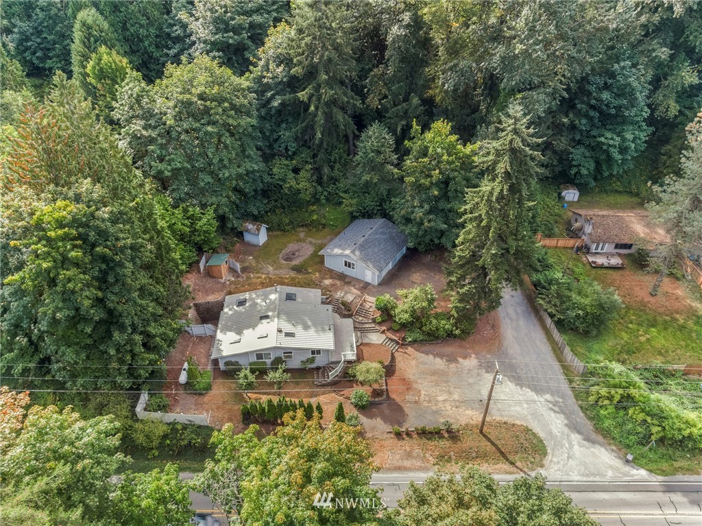 an aerial view of a house with outdoor space