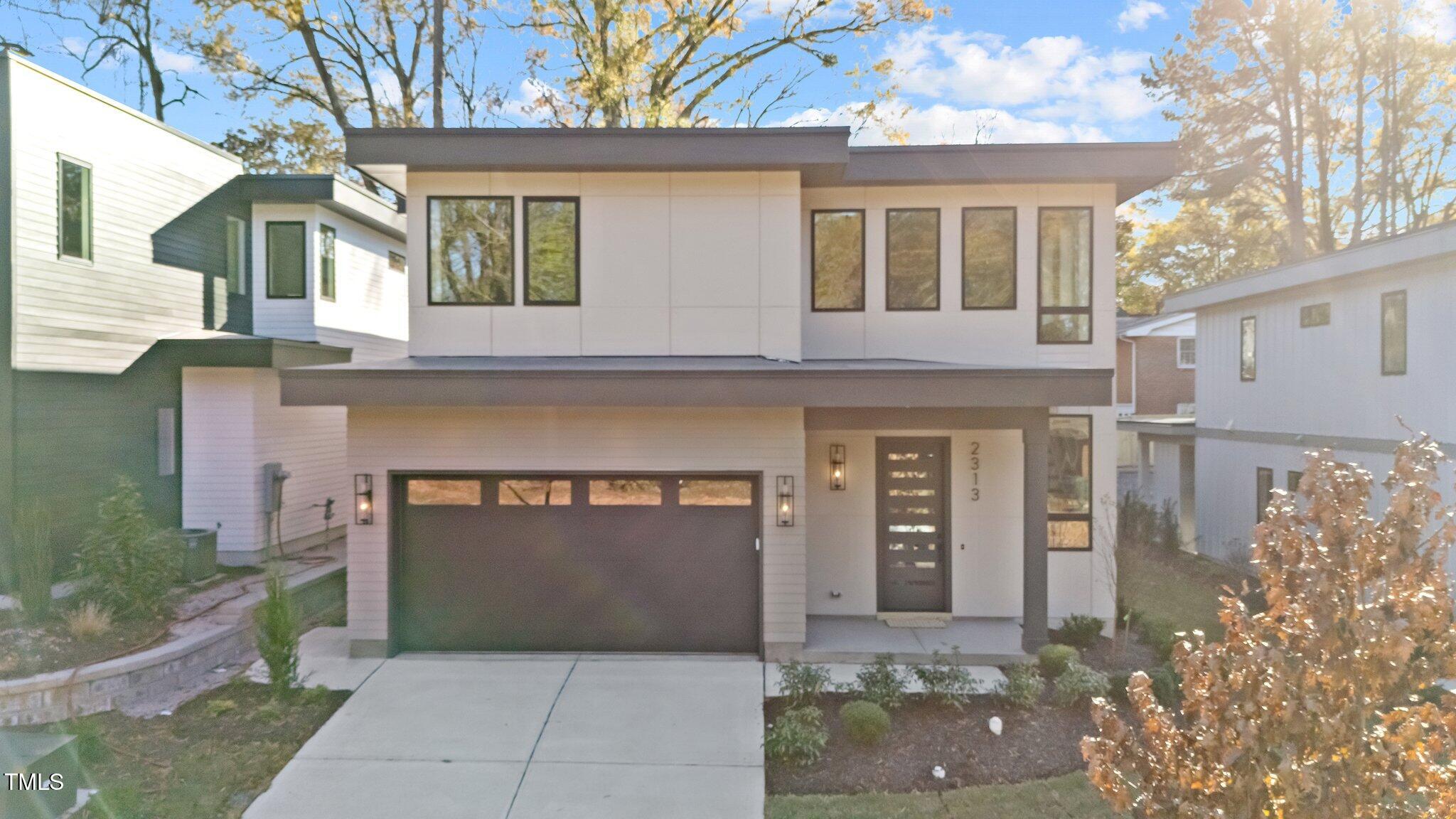 a front view of a house with yard