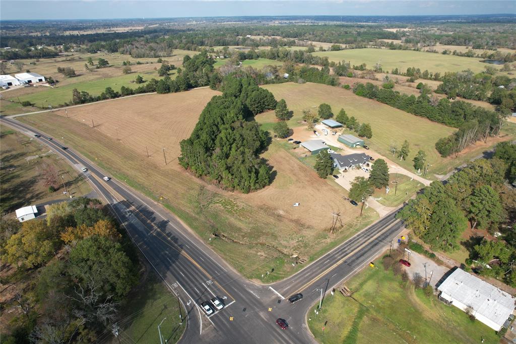 an aerial view of a residential houses with outdoor space