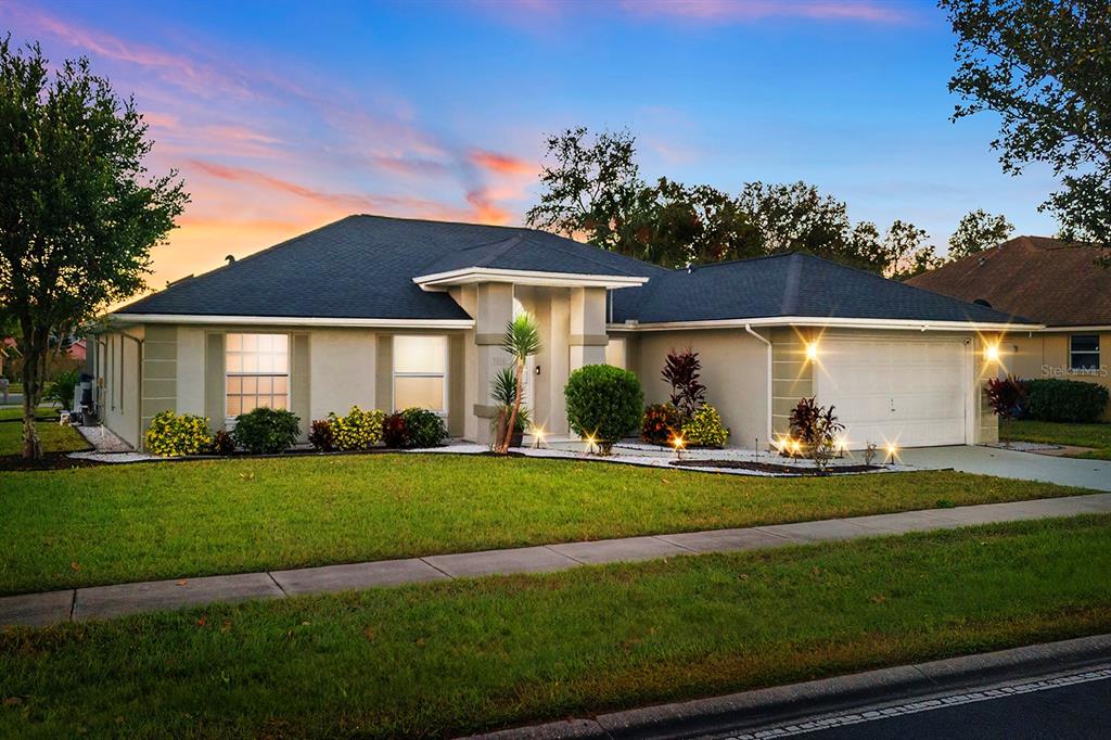 a front view of a house with a yard