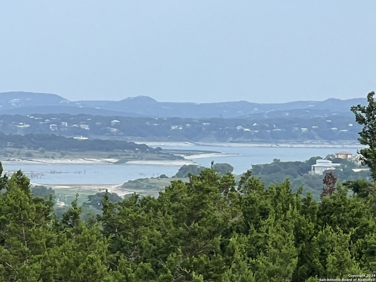 a view of a lake with mountains in the background