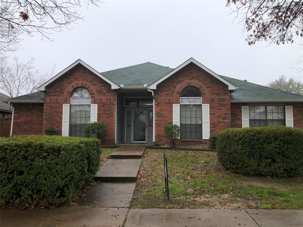 a front view of a house with yard