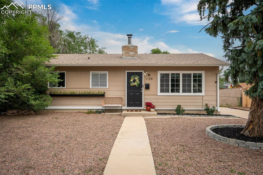 a front view of a house with garage