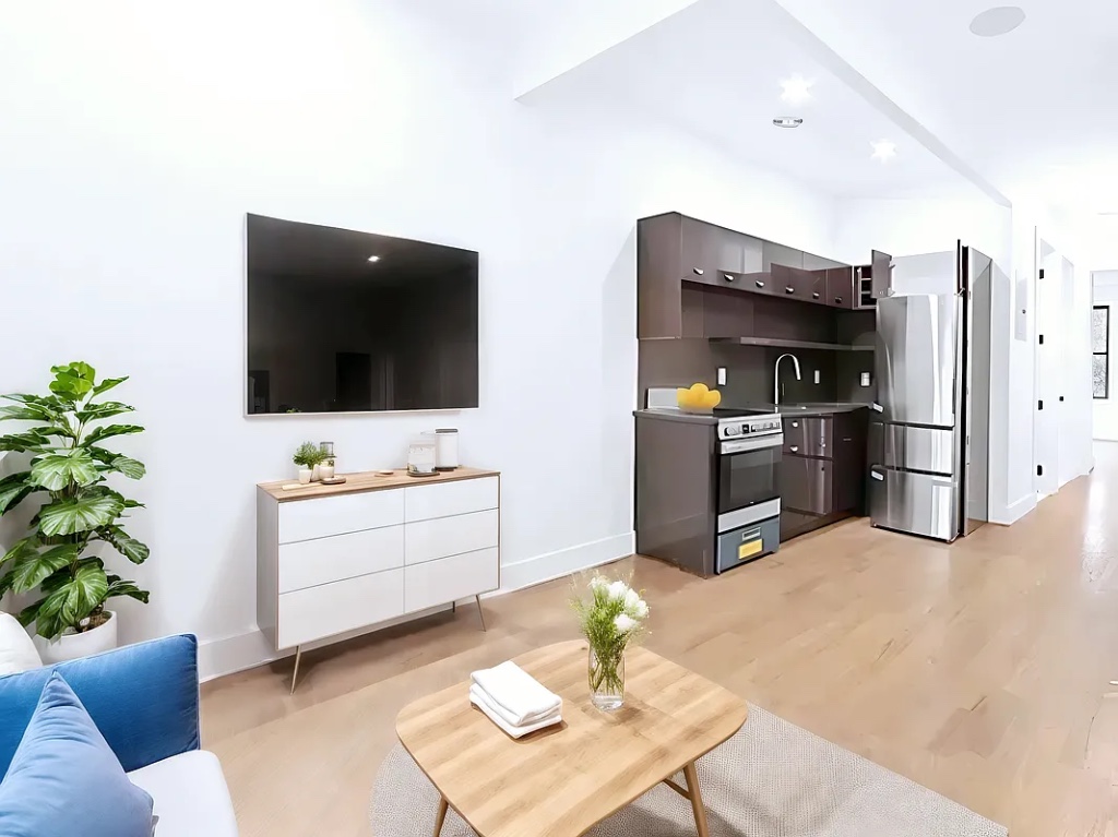 a living room with furniture and a flat screen tv