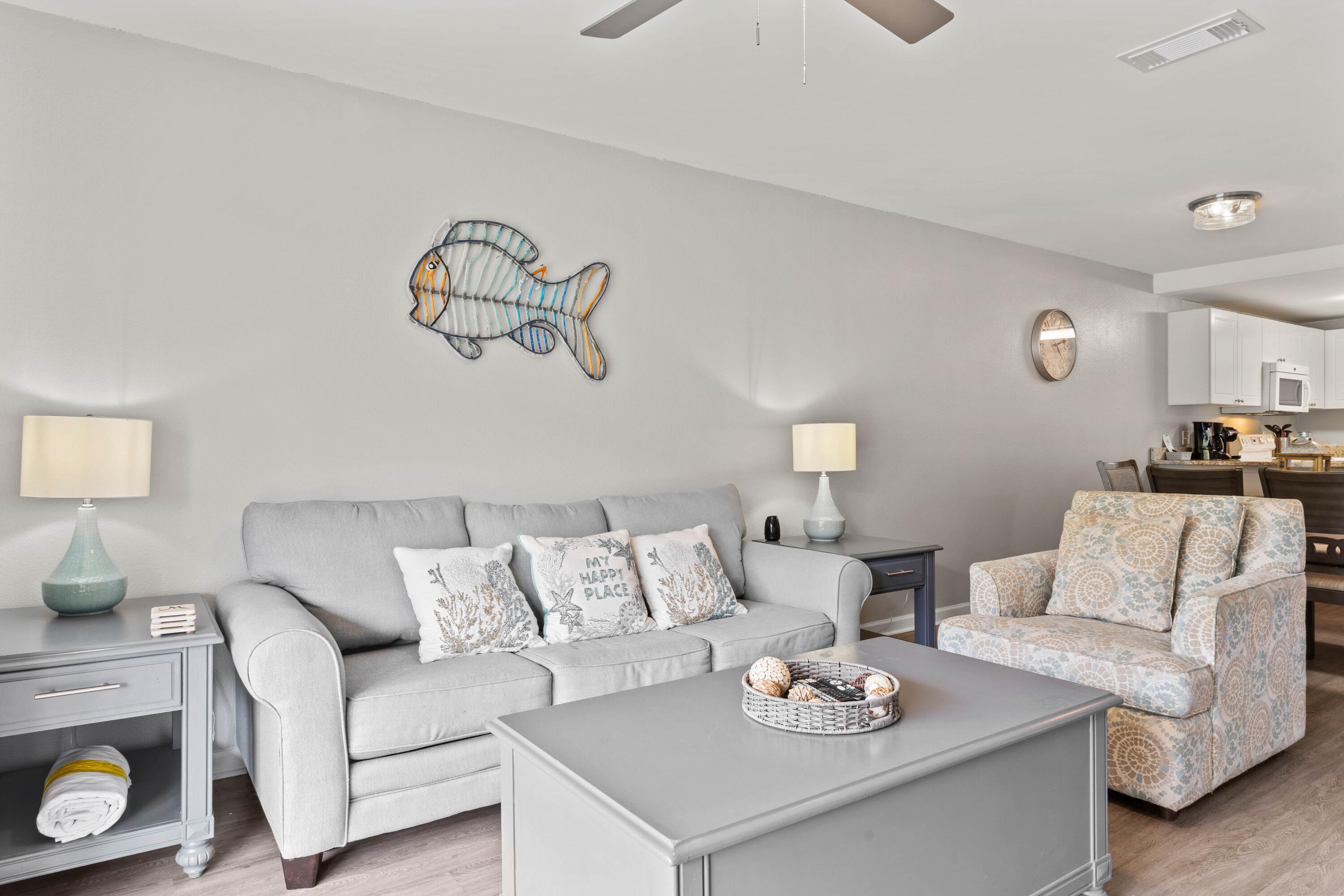 a living room with furniture and white wall