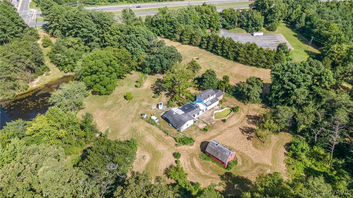 an aerial view of residential houses with outdoor space