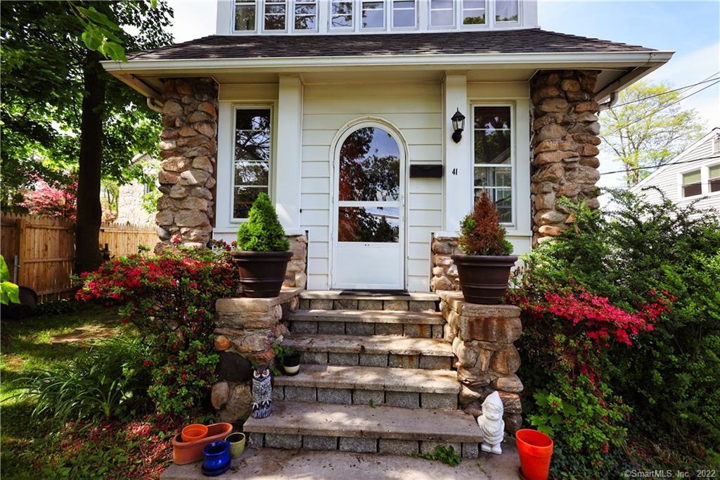 a front view of a house with a porch