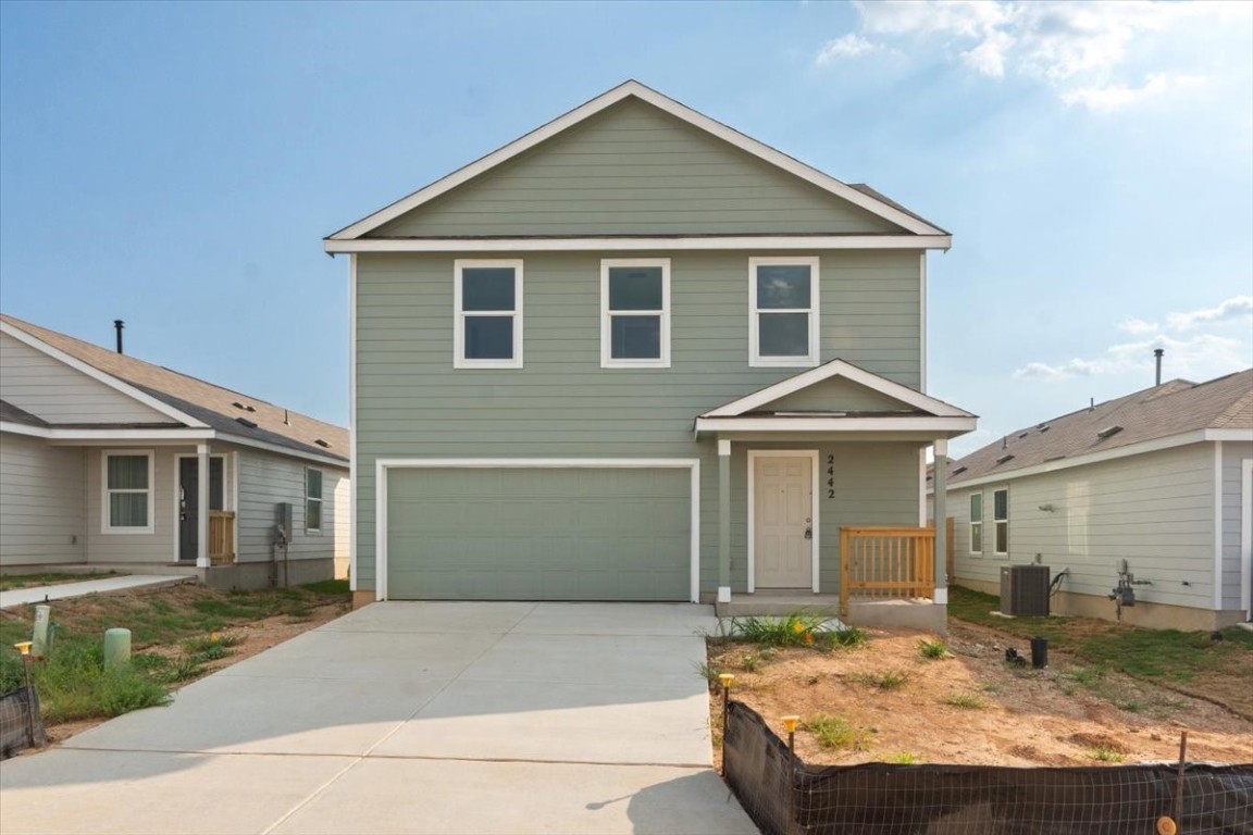 a front view of a house with yard