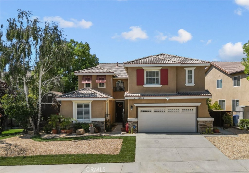 a front view of a house with yard