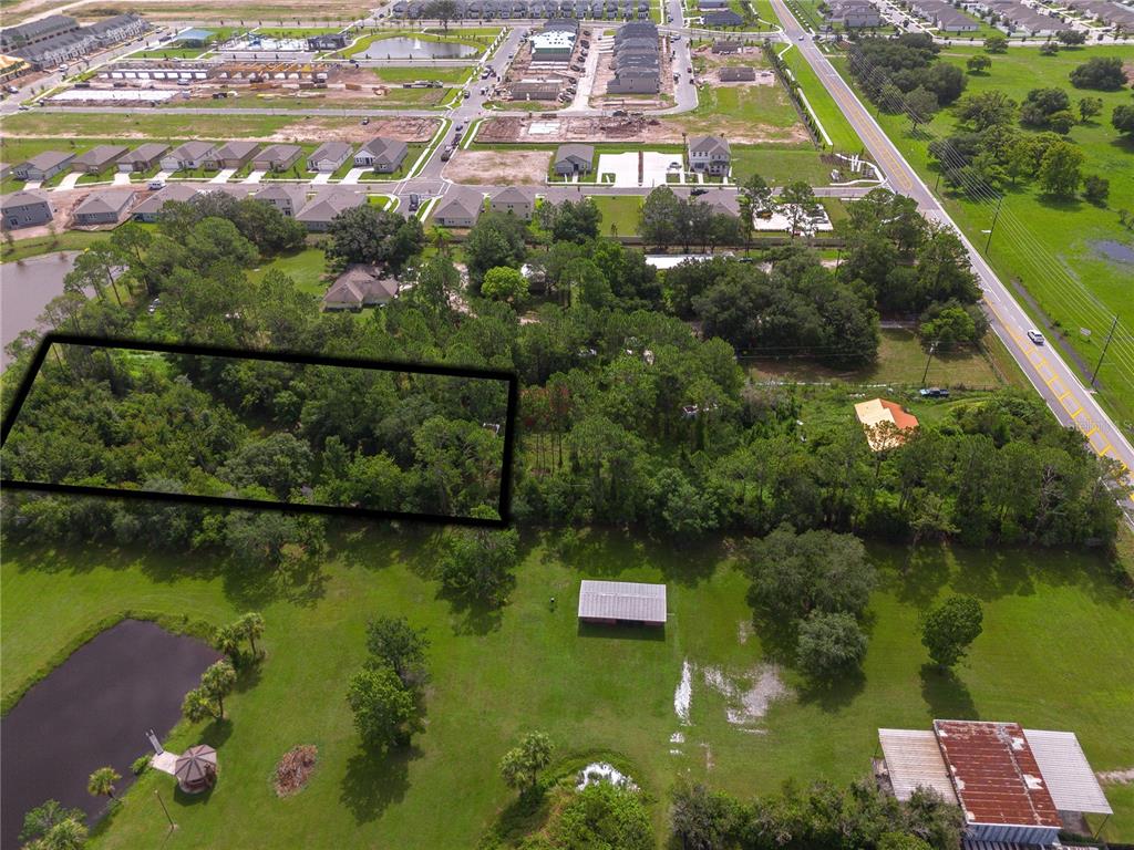 an aerial view of lake residential houses with outdoor space and swimming pool