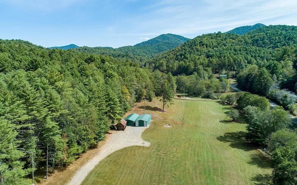 a view of a lake with a yard