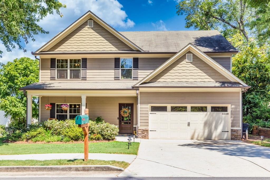 a front view of a house with a yard