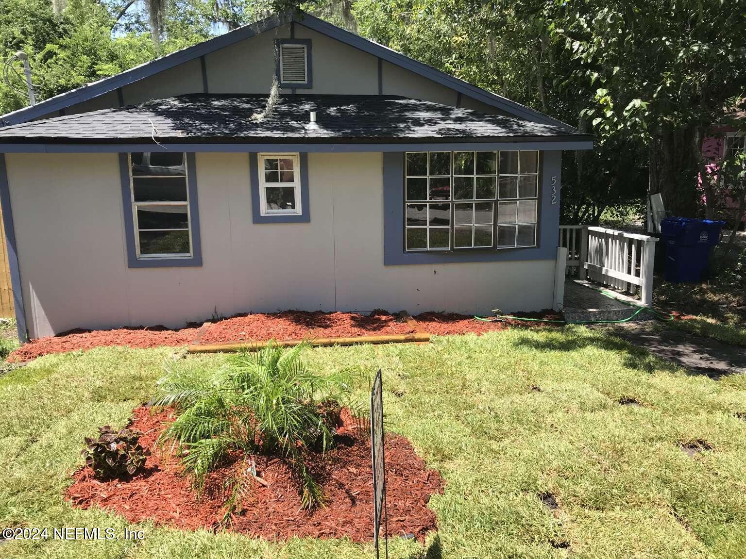 a house with trees in the background