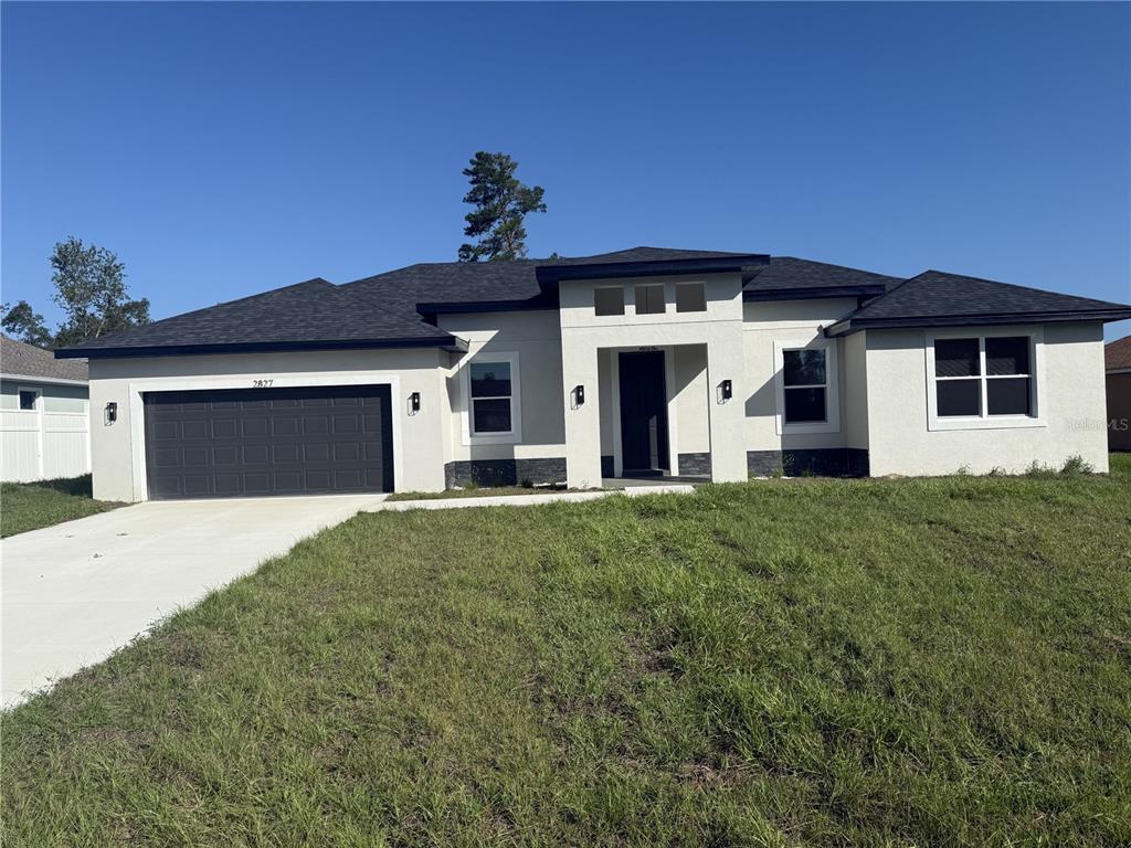 a view of a house with a garage