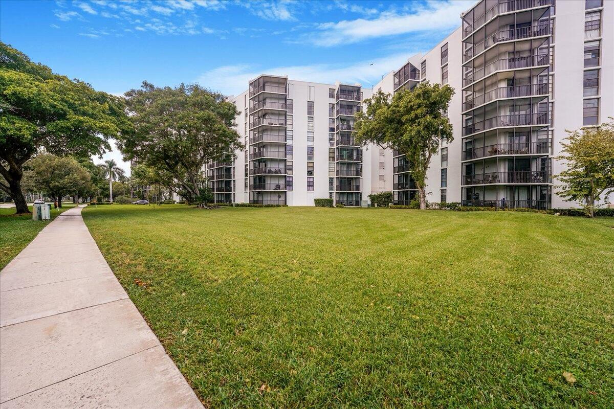 a view of a building with a yard