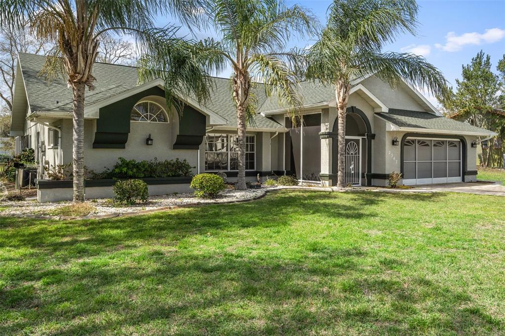 a view of a house with a yard