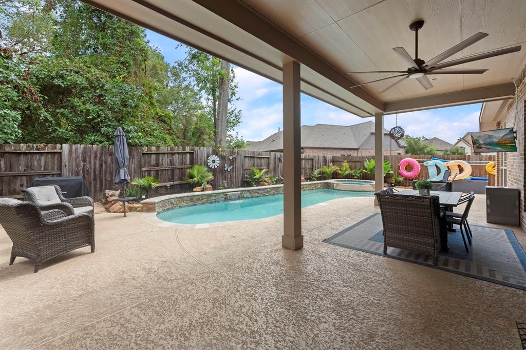 a view of a patio with a table chairs and a patio