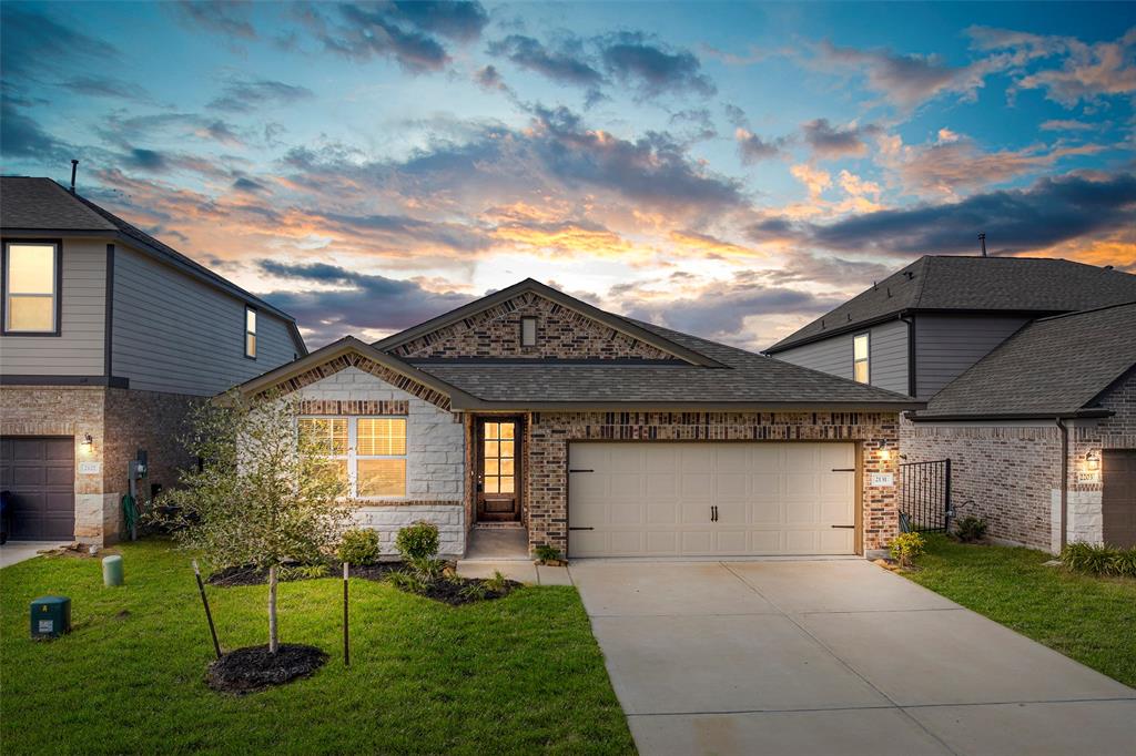 a front view of a house with a yard