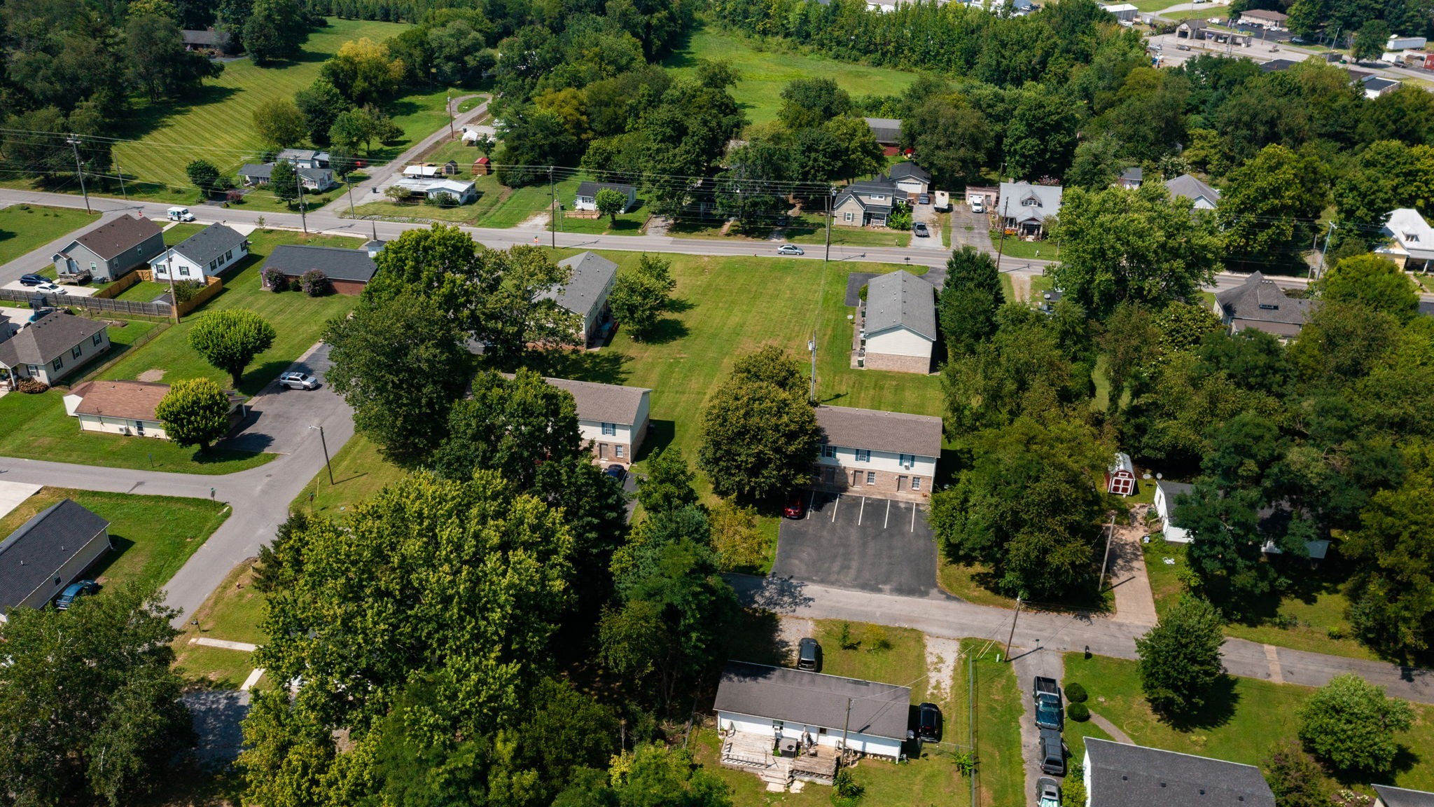 an aerial view of residential house with outdoor space and swimming pool