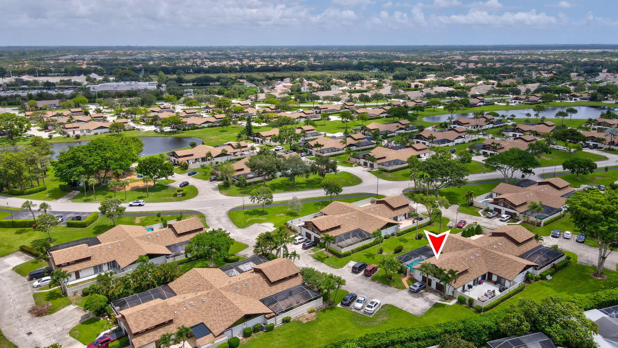 an aerial view of residential houses with outdoor space