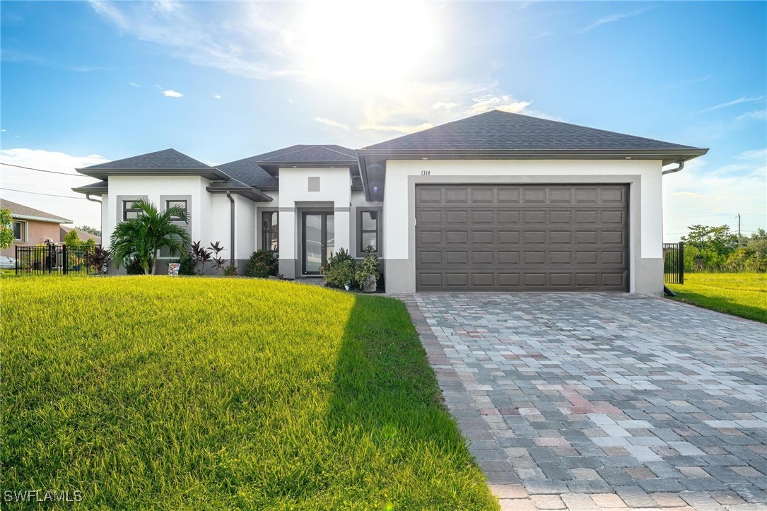 a front view of house with yard and green space