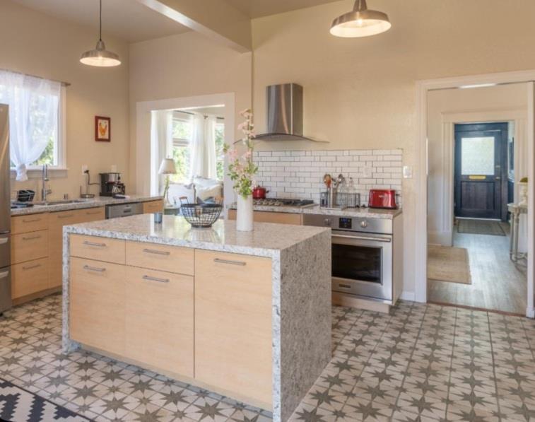 a kitchen with a sink stove and cabinets