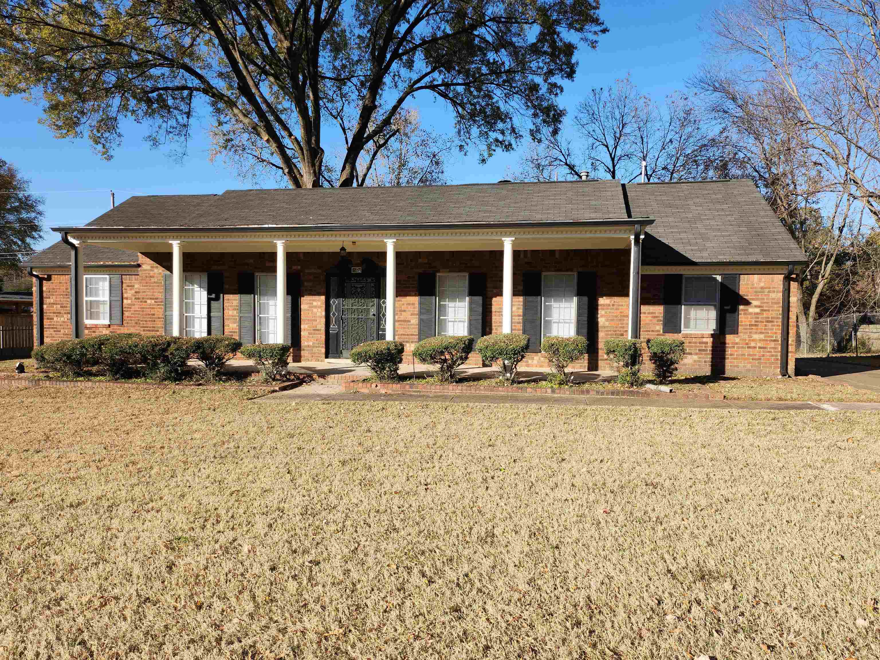 a front view of a house with fire pit