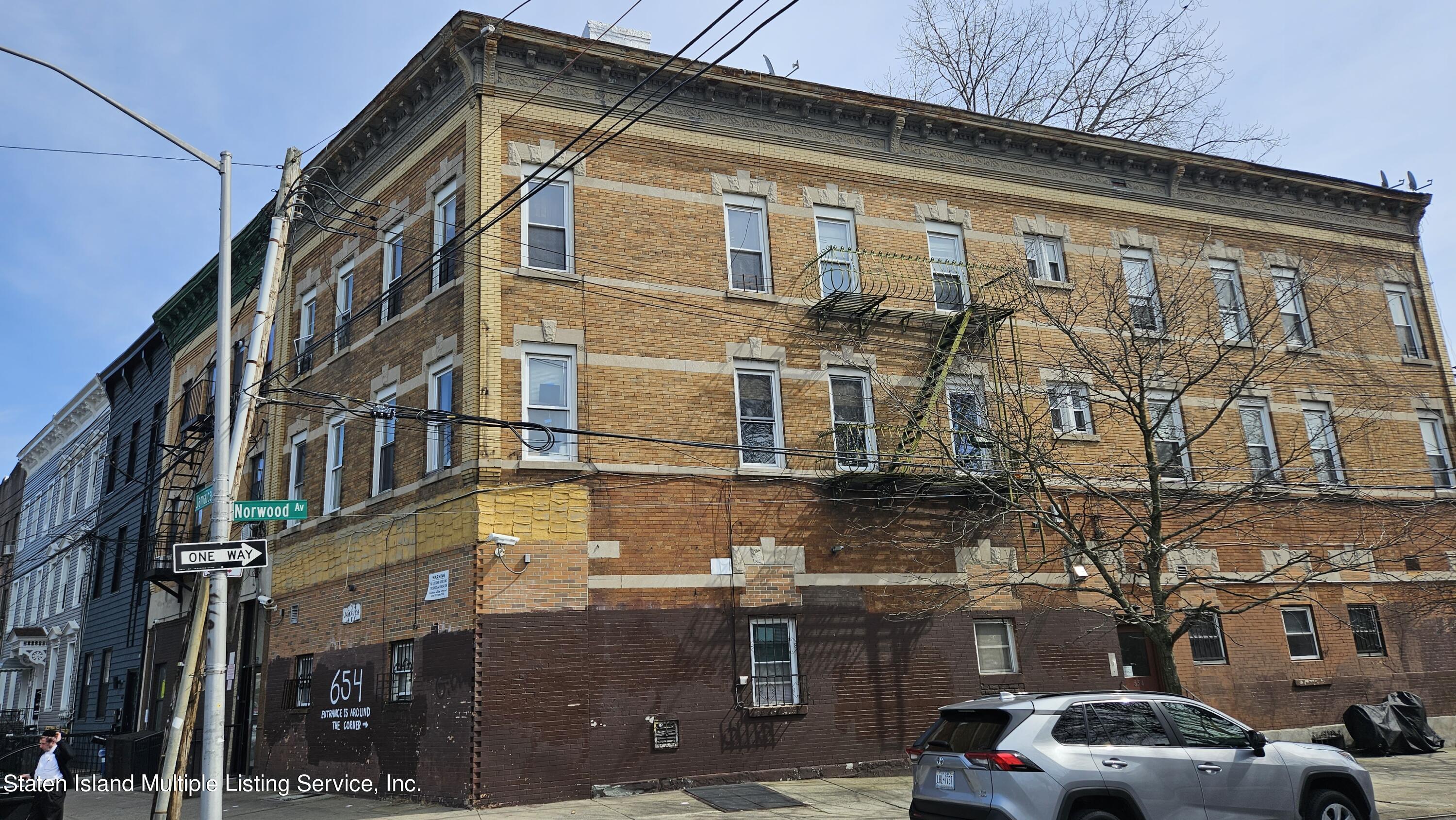 a front view of a building with parking space