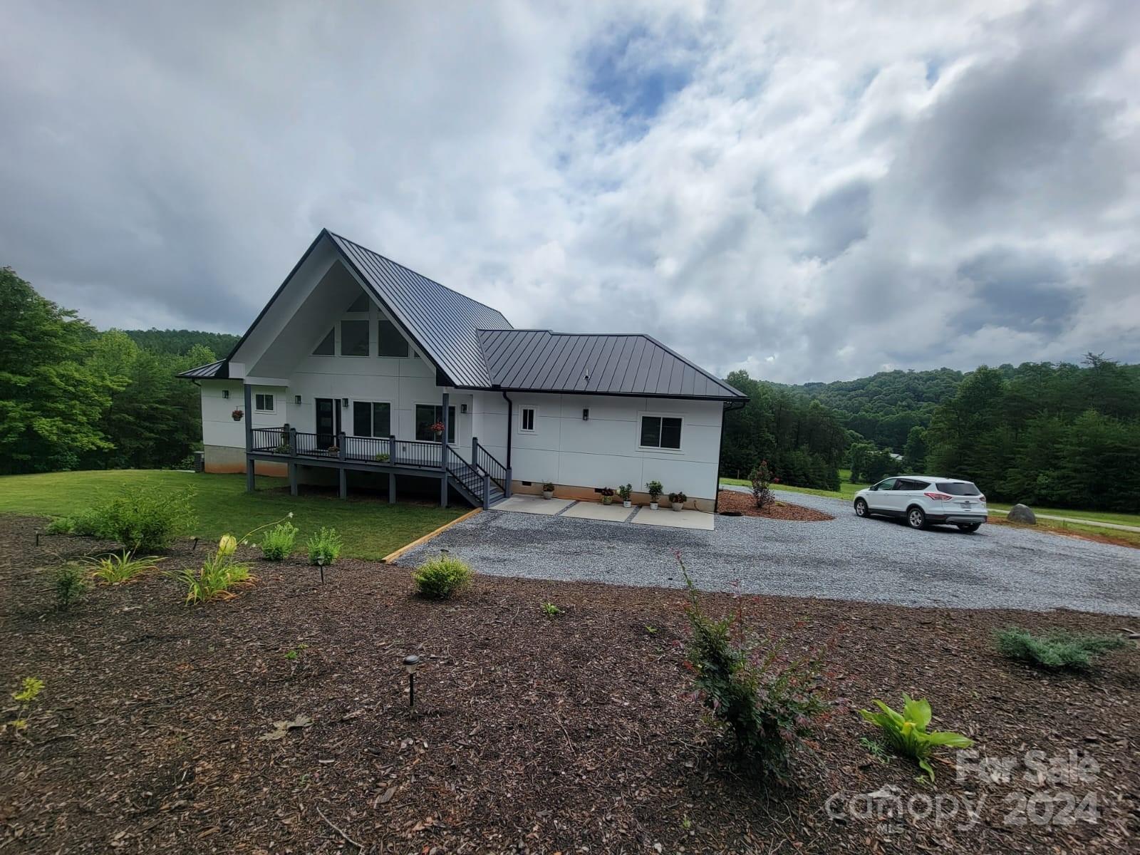 a view of house with yard and entertaining space