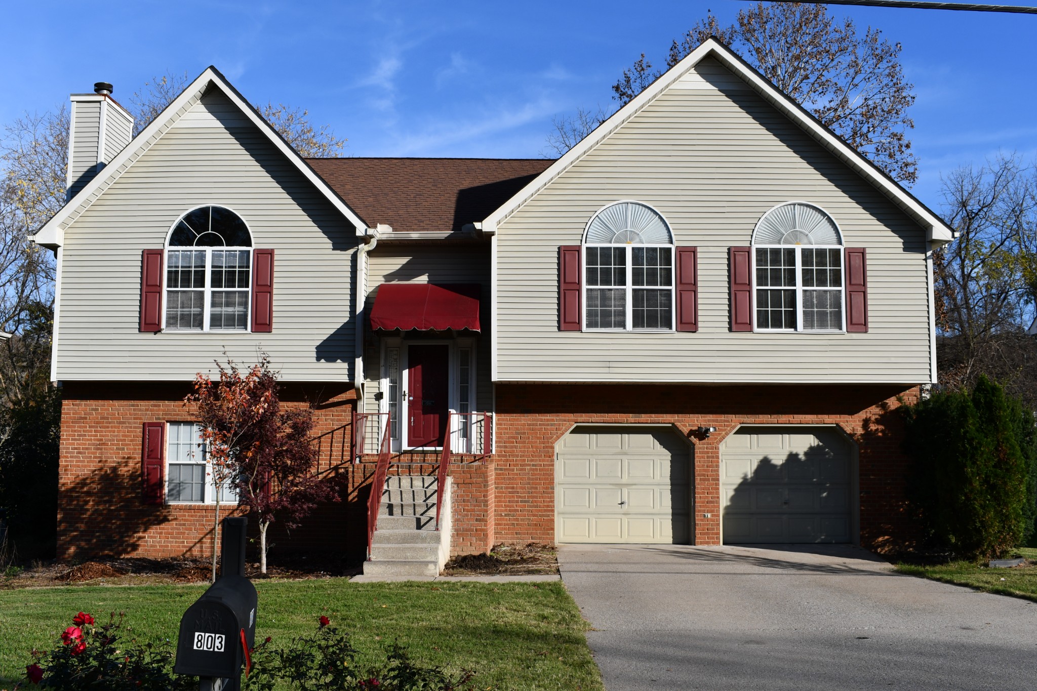 a front view of a house with a yard