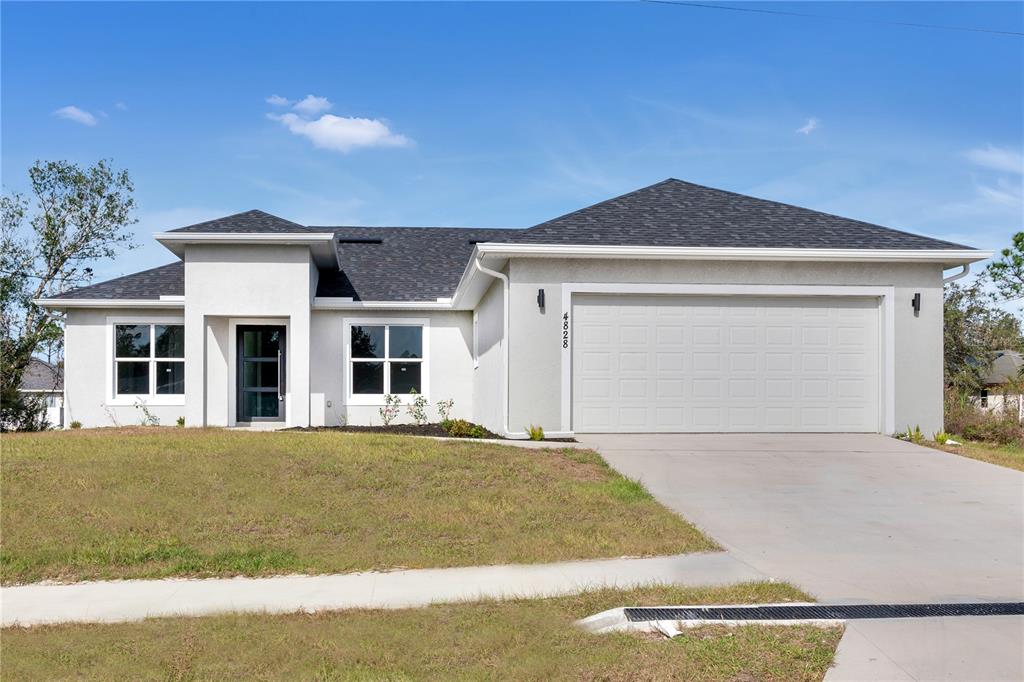 a front view of a house with yard