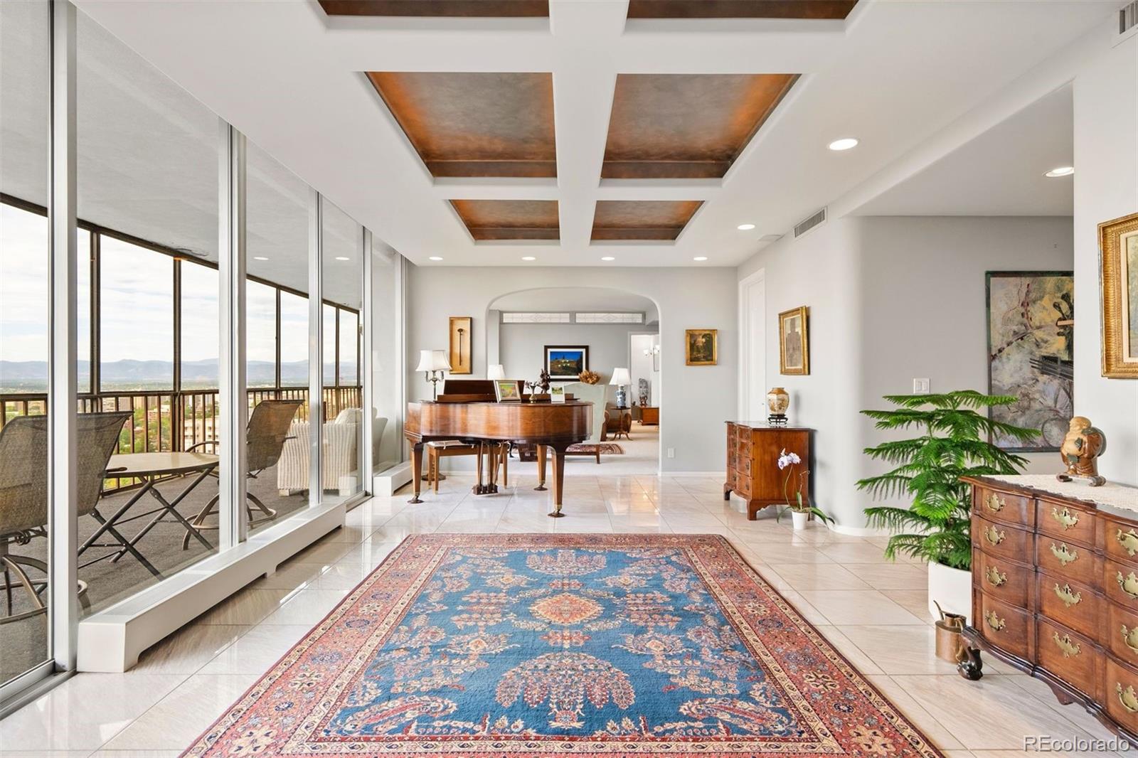 a living room with furniture and a rug