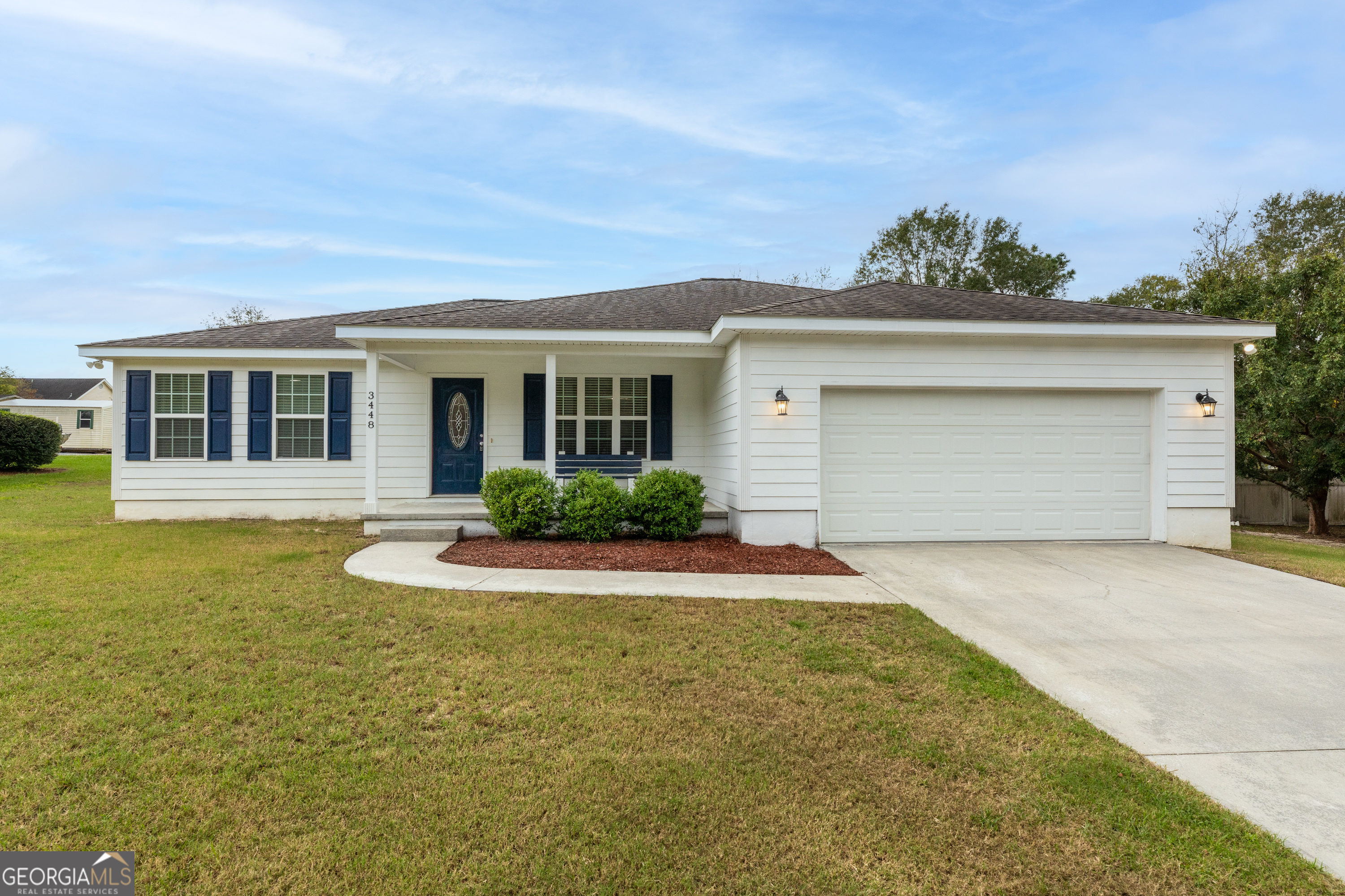 a front view of a house with yard