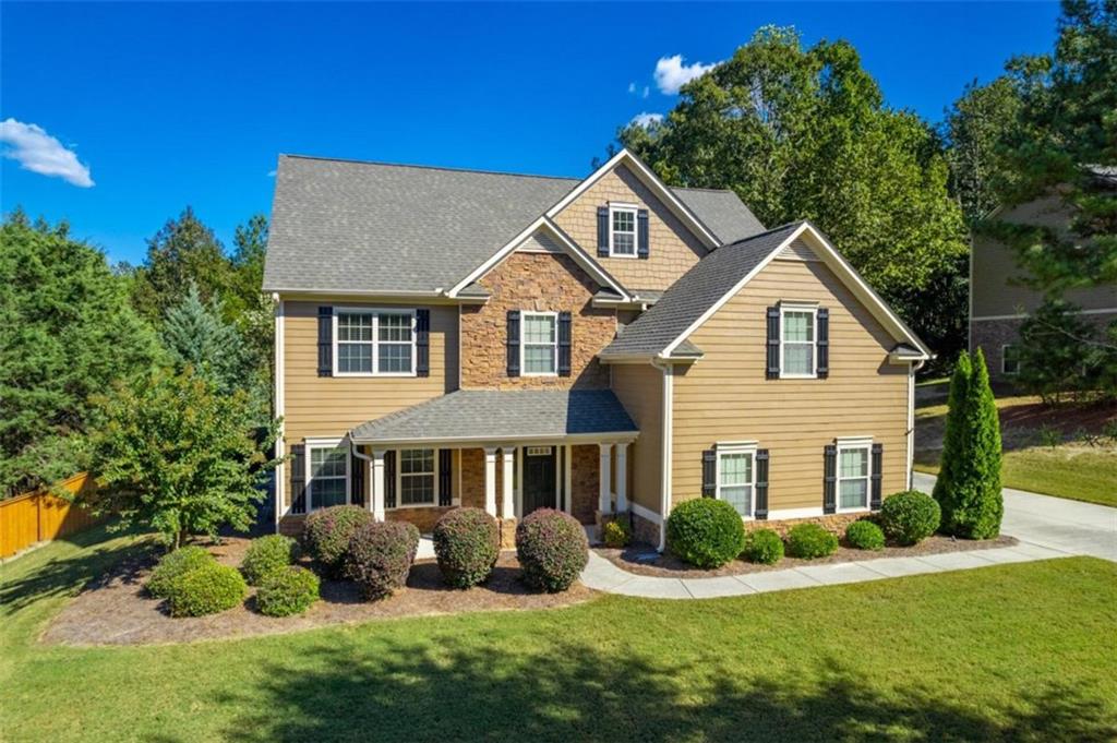 a front view of a house with a yard