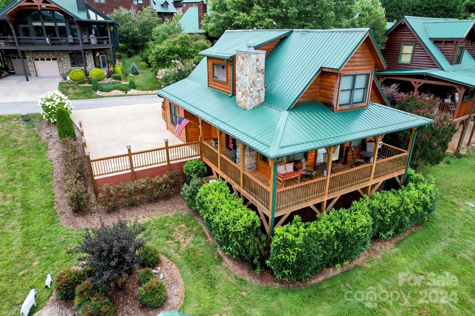 an aerial view of a house with roof deck front of house