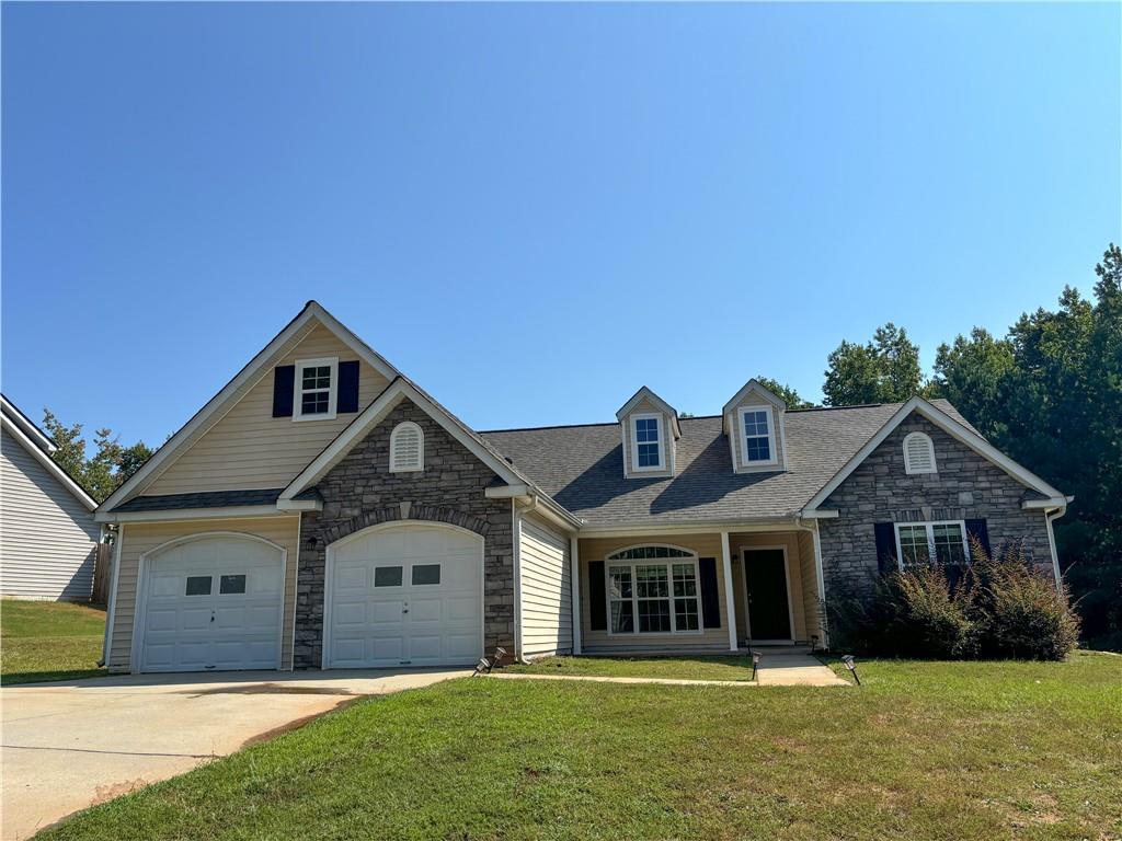 a front view of a house with a yard