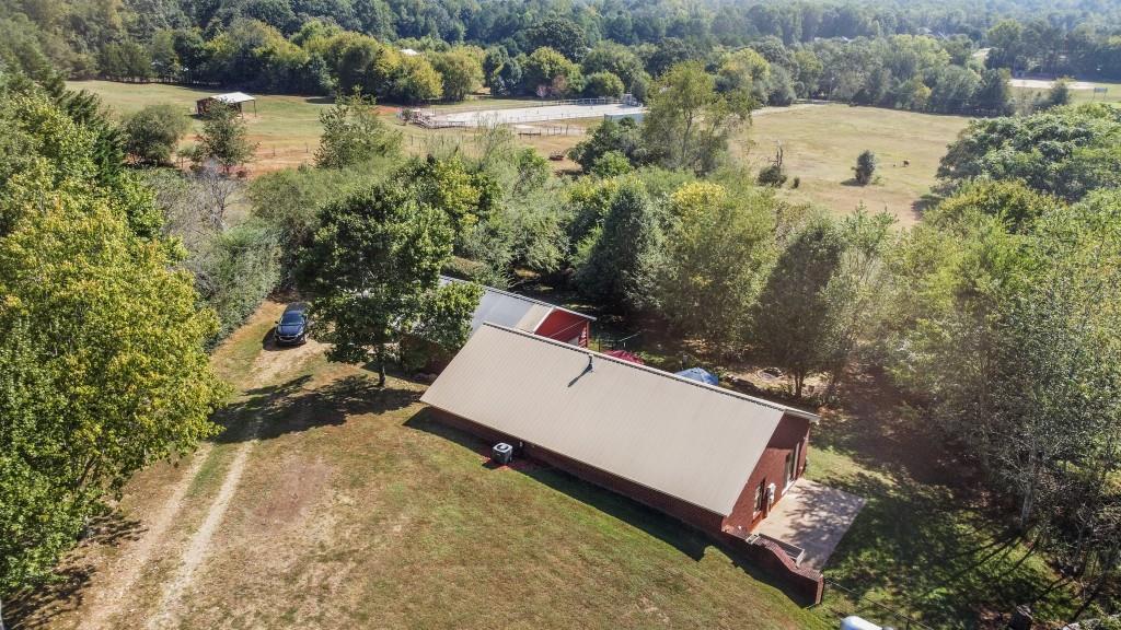 an aerial view of residential house with outdoor space and swimming pool