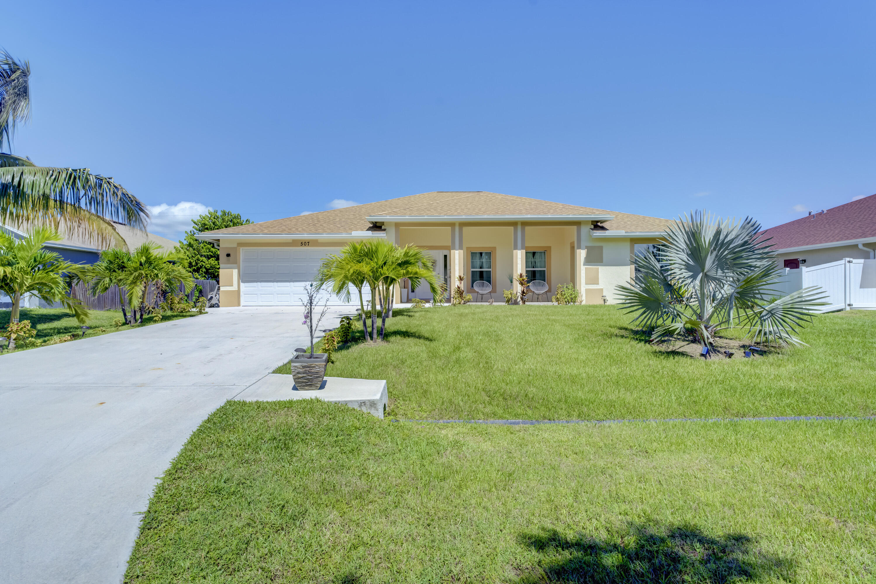 a front view of a house with a yard