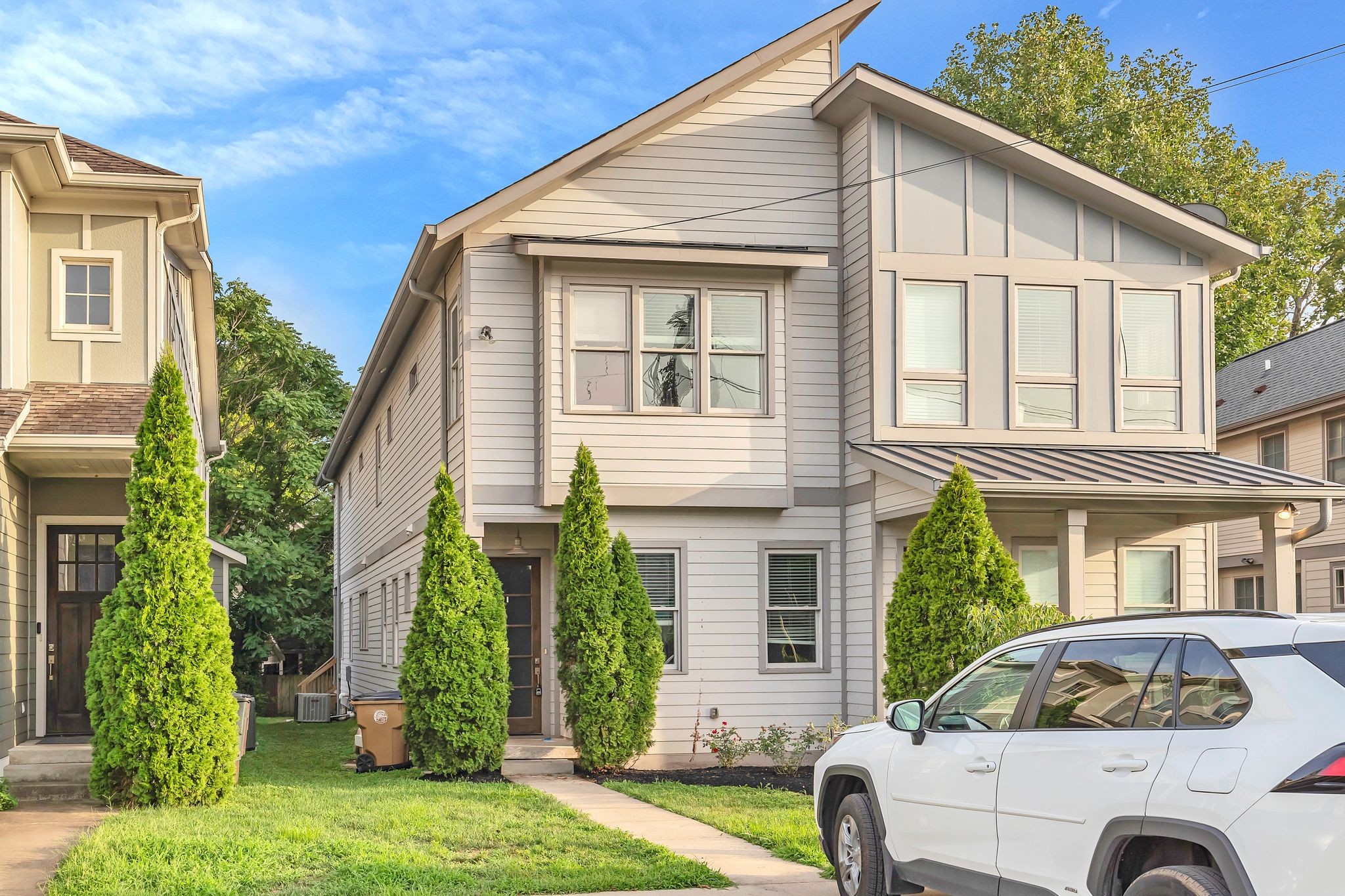 a front view of a house with garden