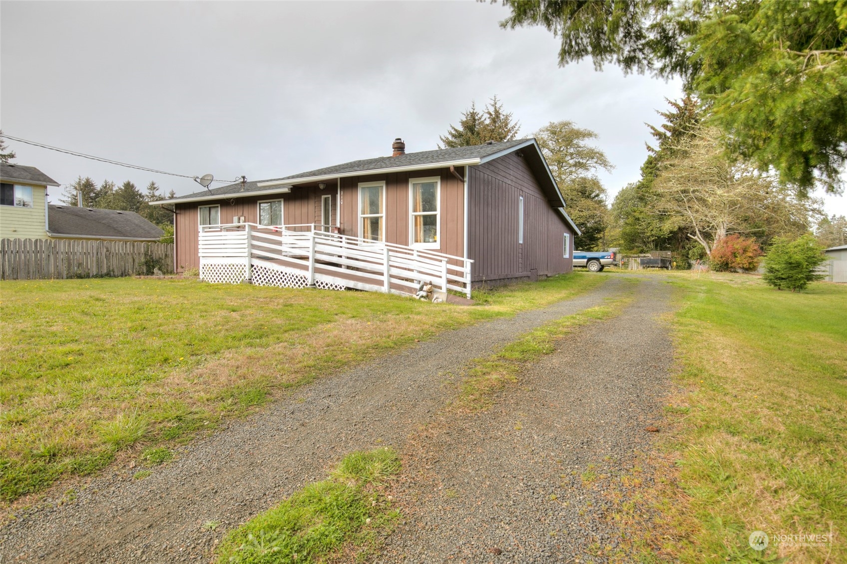 a view of a house with a yard and garage