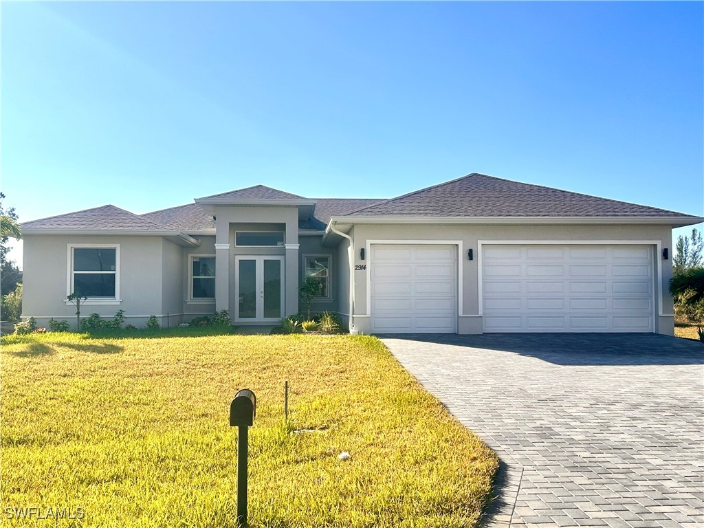 a front view of a house with a yard