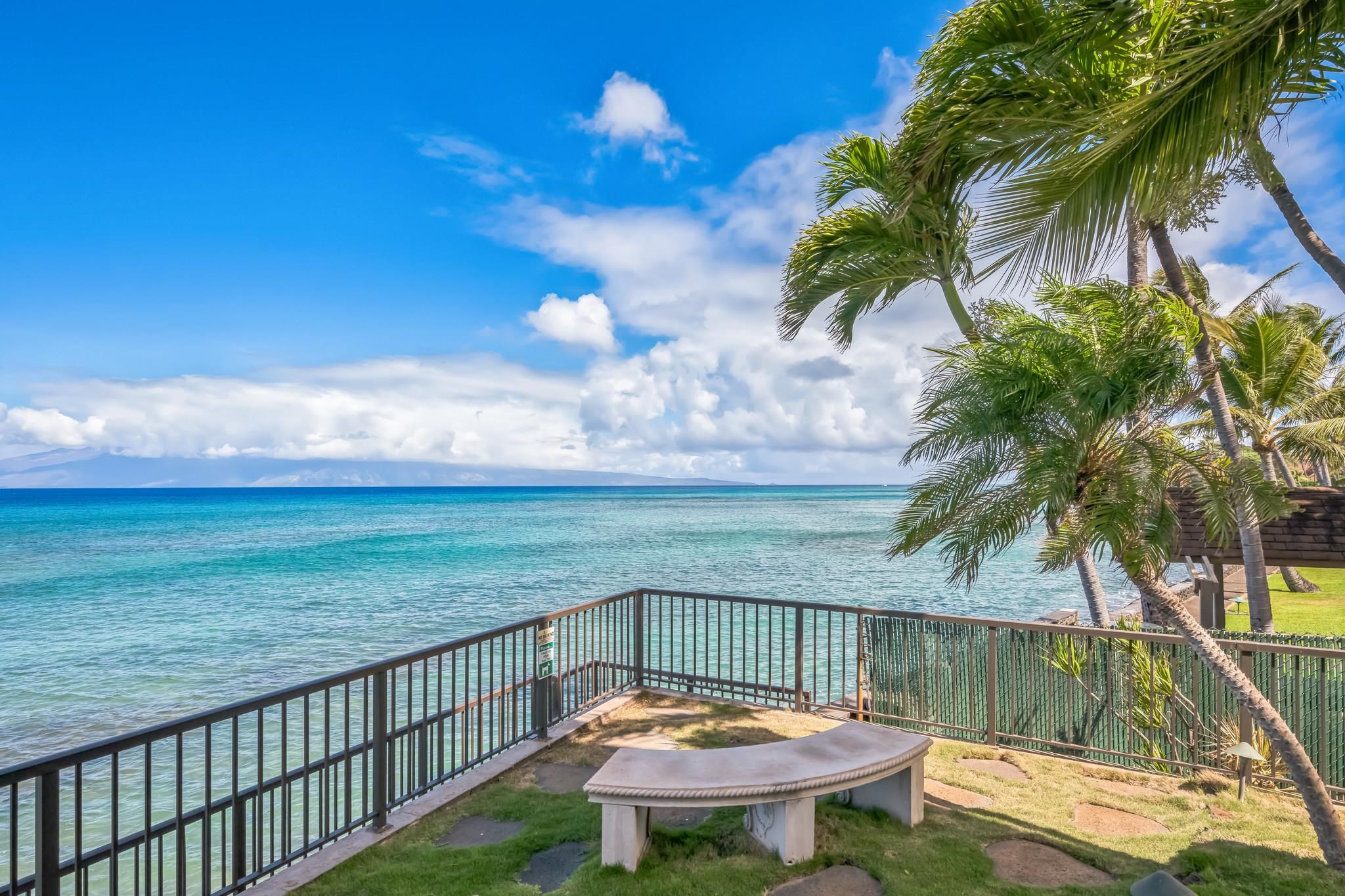 a view of a balcony with a table and chairs