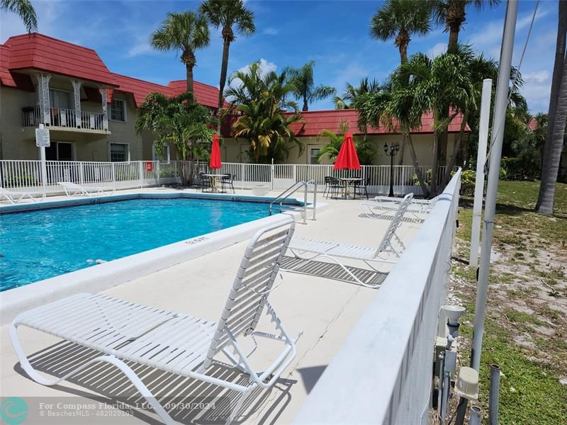 a view of a patio with swimming pool