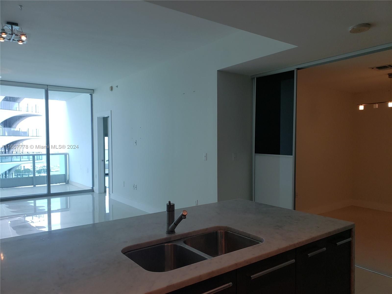 a kitchen with a sink and cabinets