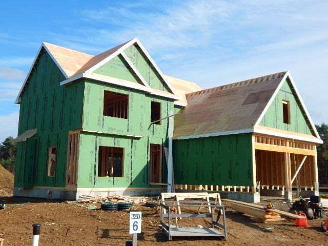 a front view of a house with garage